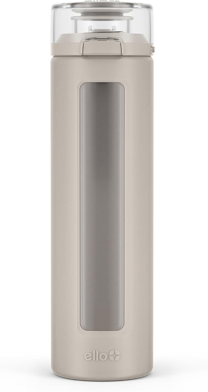 Ello Syndicate 20oz Glass Water Bottle with Flip Lid and Sleeve, Sand | Glass water bottle for iced drinks with leakproof flip lid, silicone sleeve, carry loop, BPA-free, and dishwasher safe